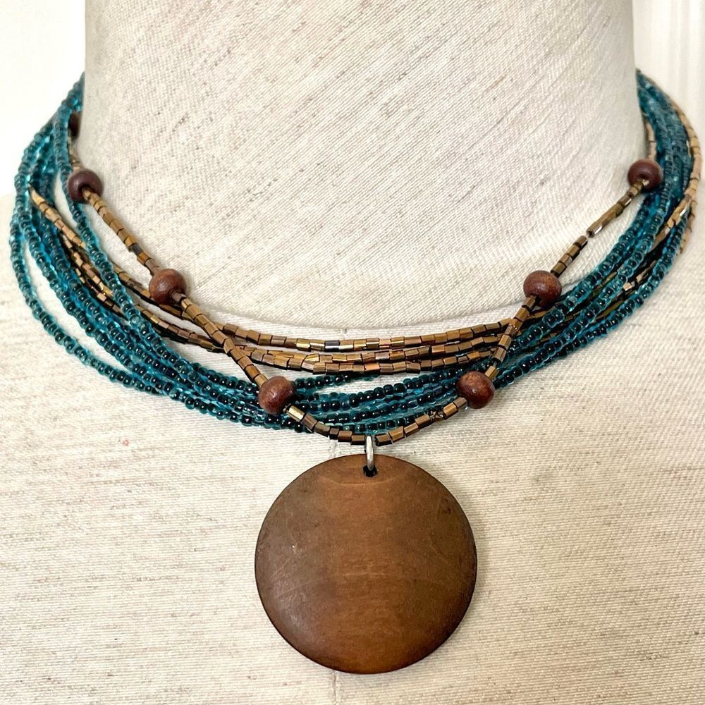 Blue and gold beaded multi strand wood pendant necklace